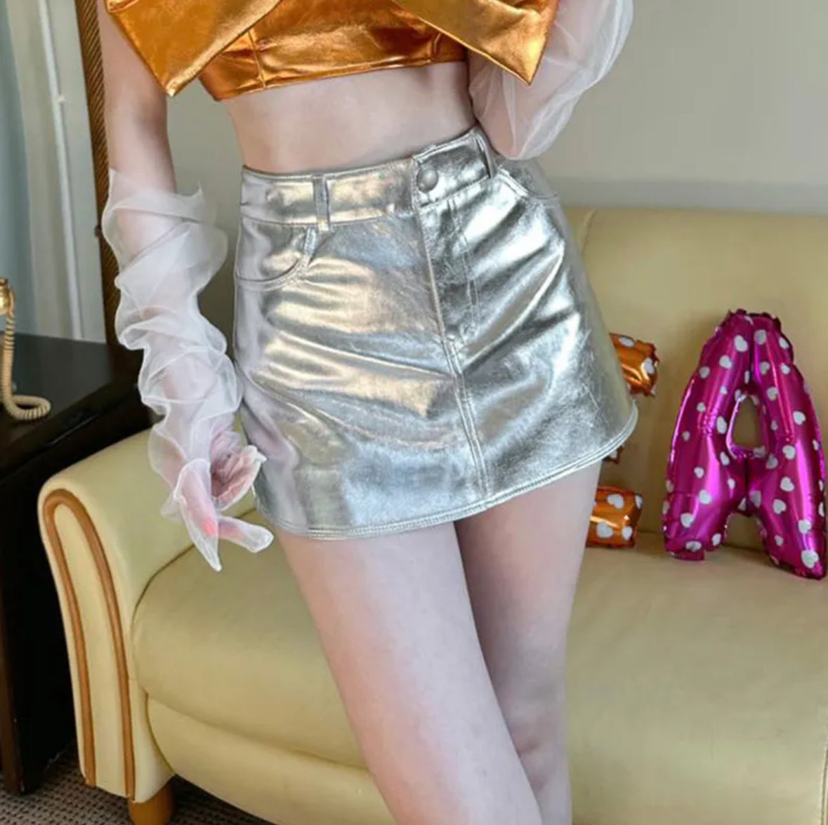 Glittery leather mini skirt